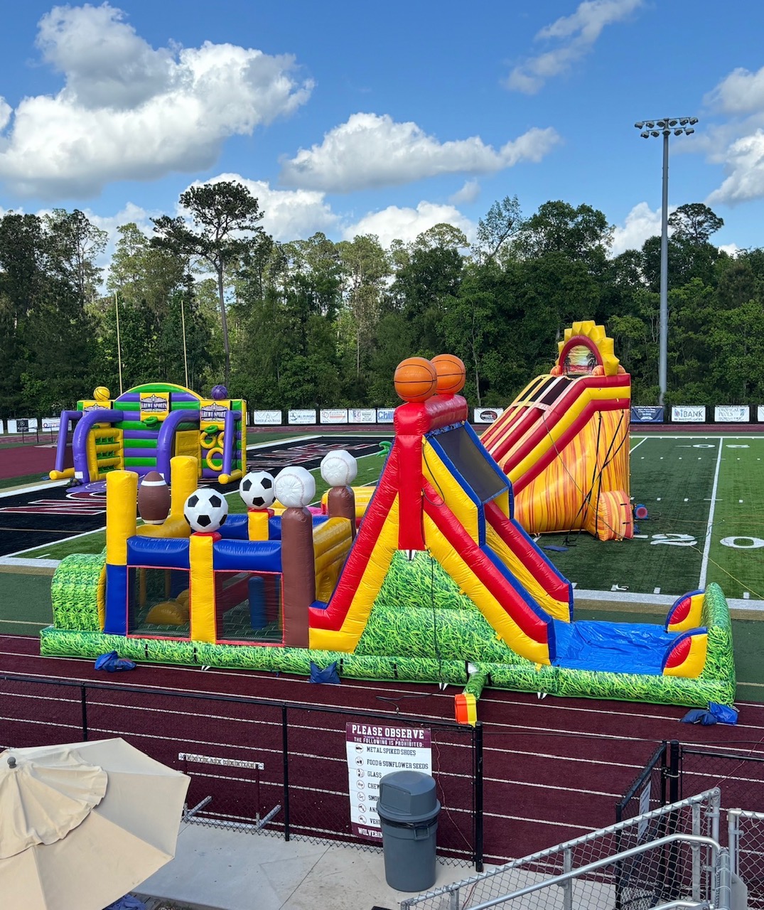 Krewe Inflatables school and festival attractions set up on a football field