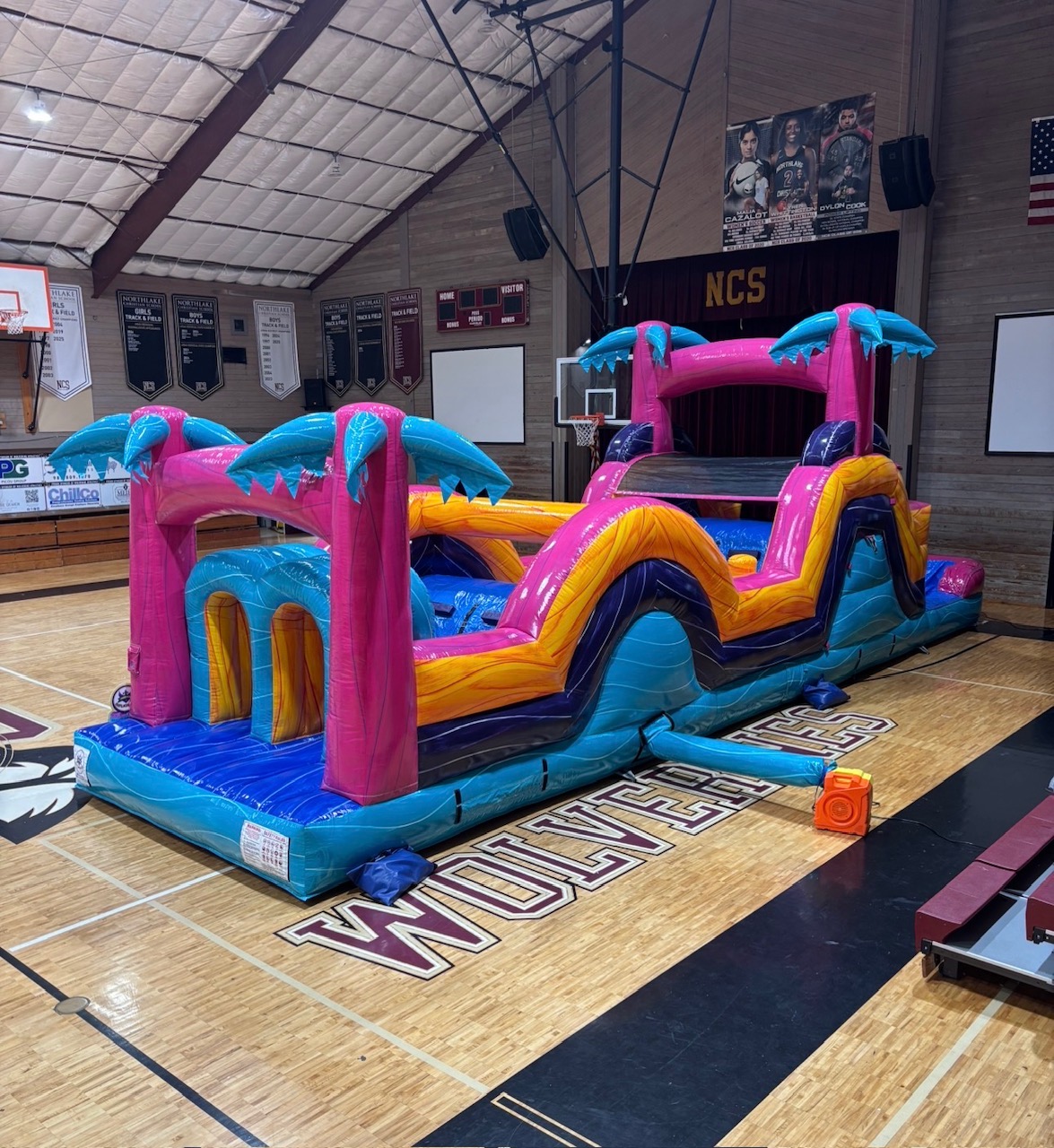 Pink Palm Racer obstacle course set up for an indoor school event